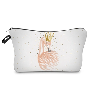 Detailed view of white flamingo print makeup bag with a gold crown and polka dots