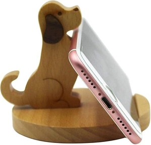 Macro view of a cute puppy-shaped wooden smartphone stand with smooth natural textures