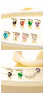 Macro shot of 3mm heart-shaped cubic zirconia L-shaped nose studs in various colors