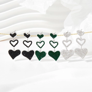 Three-tier heart drop earrings in black, green and white with sparkling zircon stones
