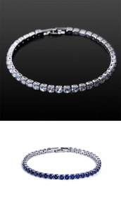 Detail of classic silver tennis bracelets with white and blue cubic zirconia stones