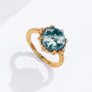 Exaggerated geometric gold ring with green moss agate stone and white zircon accents