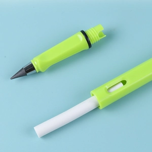 Green inkless eternal pencil showing disassembled metal nib and core on light blue background