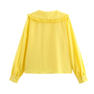 Back view of a yellow long sleeve blouse featuring a ruffled Peter Pan collar