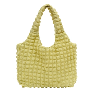 Light yellow puff textured quilted tote bag for women with a minimalist cream aesthetic