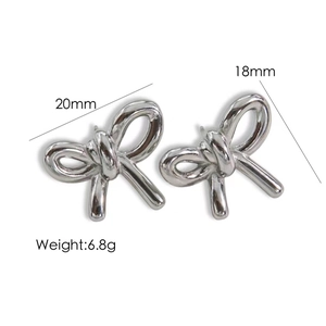 Detail view of silver bow earrings showing dimensions 20mm by 18mm and 6.8g weight