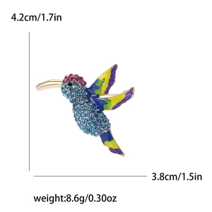 Colorful hummingbird brooch with blue rhinestones and enamel on a golden metal base