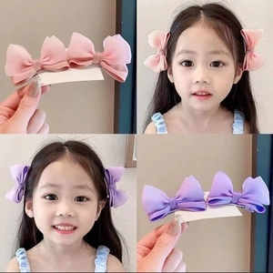 Cute children's 3D mesh bow hair clips in pink and purple colors for baby girls