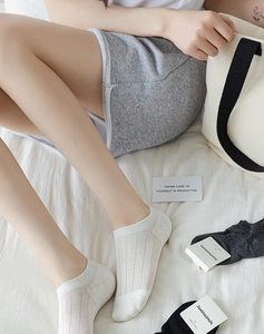 Detailed shot of combed cotton low cut invisible socks in white, black and dark grey