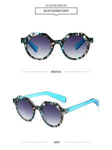 Detailed macro view of vintage polygon sunglasses with blue floral marble frame and gradient lenses