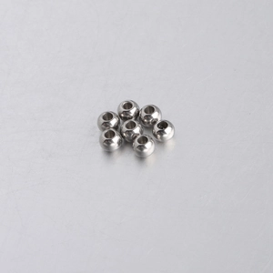 Close-up of seven 5mm polished stainless steel spacer beads with 2mm holes for DIY jewelry