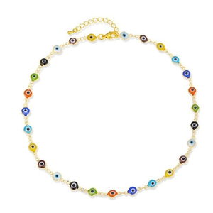 Detail of gold necklace featuring colorful evil eye beads and lobster clasp closure