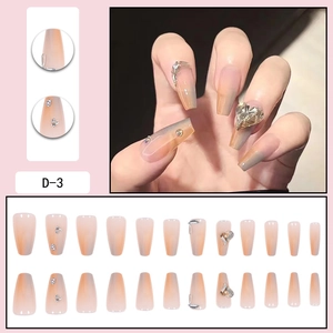 Glittery gradient press-on nails in long trapezoid shape with heart rhinestones