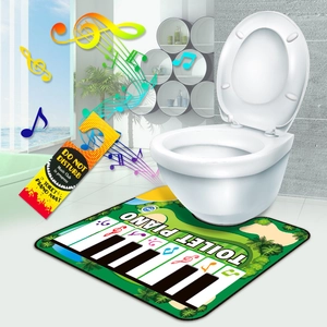 Funny musical toilet piano mat in front of a toilet with do not disturb door sign