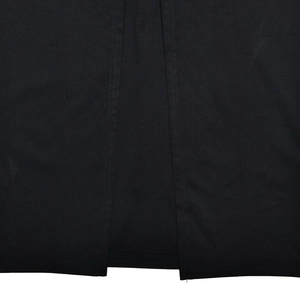 Detailed close-up showing the premium black fabric texture and stitching of the slim dress