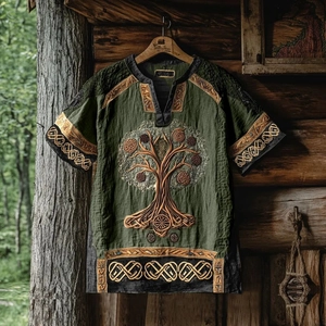 Detail of Tree of Life embroidery and Celtic knots on green cotton linen t-shirt