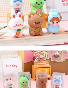 Close-up of cute cartoon pencil sharpener figurines with rabbit and bear desktop decor