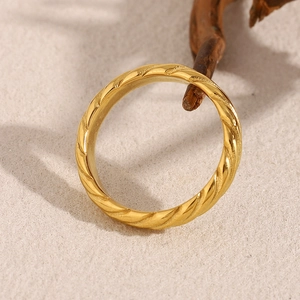Macro shot of 18K gold plated stainless steel ring with classic diagonal twist texture
