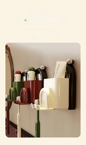 Wall-mounted bathroom organizer set with suction cups and colorful inverted mouthwash cups
