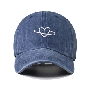 Vintage washed blue denim baseball cap with heart embroidery and curved brim for outdoor sun protection