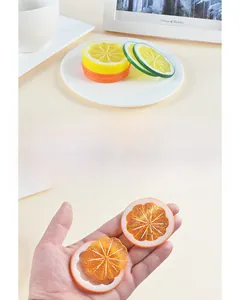 Macro shot of realistic PVC lemon and lime slices for cake decoration and photography