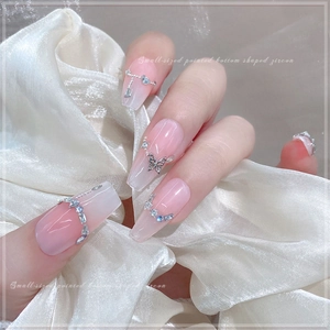 Pink gradient press-on nails featuring silver metal butterflies and zircon stones