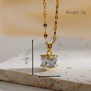 Macro view of a 1.5cm square-cut zircon pendant with four-claw setting on a gold chain