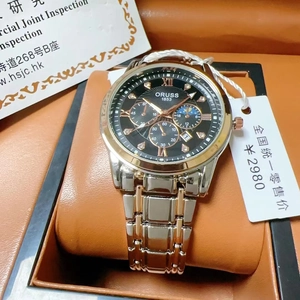 Detail showing the ORUSS 1853 quartz watch with two-tone steel band and black dial