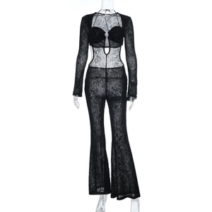 Close-up of black lace hollow-out fabric with sheer texture and floral embroidery detail