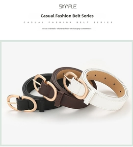 Close-up of three fashion leather belts with gold oval buckles and fine stitching details