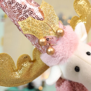 Pink Christmas reindeer doll with telescopic legs and sparkling gold sequin details