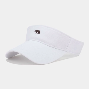 Close-up of a white breathable visor with a small brown bear embroidery on the front