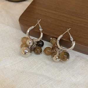 Silver needle hoop earrings with gradient resin amber beads and metallic ball charms