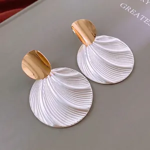 Vintage round textured stud earrings with gold and white fan relief design for women