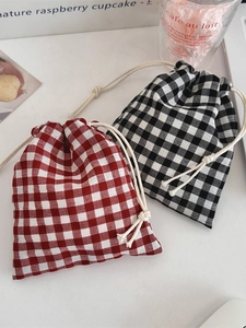 Classic checkered drawstring storage bags in black and red plaid cotton linen fabric