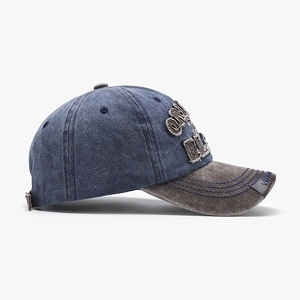 Vintage washed navy and grey baseball cap with distressed embroidery on white background