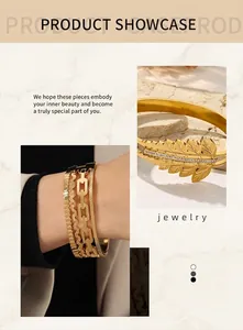 Detail of 18K gold leaf bracelet with sparkling zircons and layered chain bracelets
