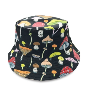 Close-up of vibrant mushroom print patterns on a black cotton bucket hat fabric