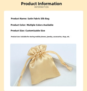 Detailed view of glossy champagne satin drawstring pouch for jewelry and accessories