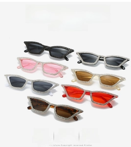 Close-up of cat-eye sunglasses collection with sparkling rhinestones in various colors