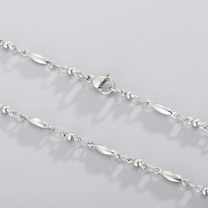 Close-up of silver stainless steel bead chain with olive links and lobster clasp