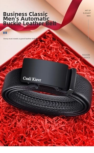 Detail of men's black automatic buckle leather belt in a red luxury gift box setting