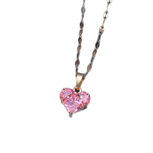 Elegant rose gold titanium necklace featuring a pink heart-cut zircon pendant on white backdrop