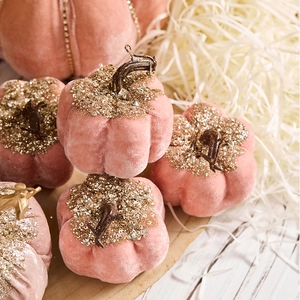 Pink velvet pumpkin ornament with gold glitter accents for luxury Christmas table decor