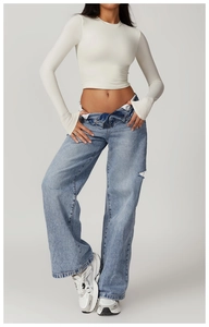 Detailed view of women tight long-sleeve crop top with crew neck in cream white