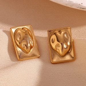 Detail of 18K gold-plated irregular rectangular stud earrings with abstract heart relief
