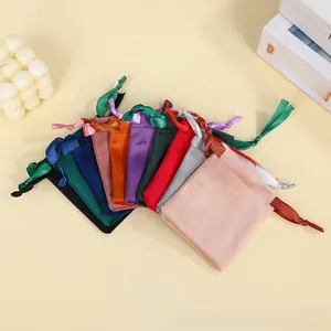 Detailed flat lay of colorful velvet drawstring pouches for jewelry storage and gifts