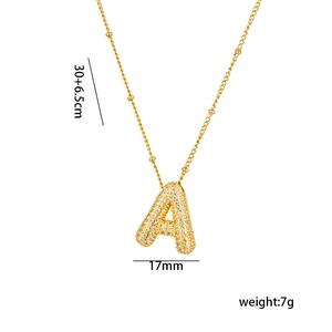 Detailed specs of the gold letter A necklace with zircon inlay and beaded chain design