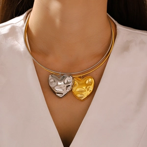 Double-layer gold and silver snake chain necklace with large fluid heart pendants