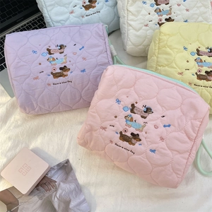 Quilted cotton makeup bags with colorful dachshund embroidery and zip closure
